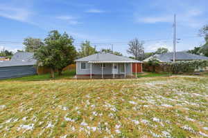 Rear view of house with a patio area and a fenced backyard