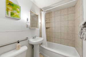 Main full bathroom featuring shower / tub combo