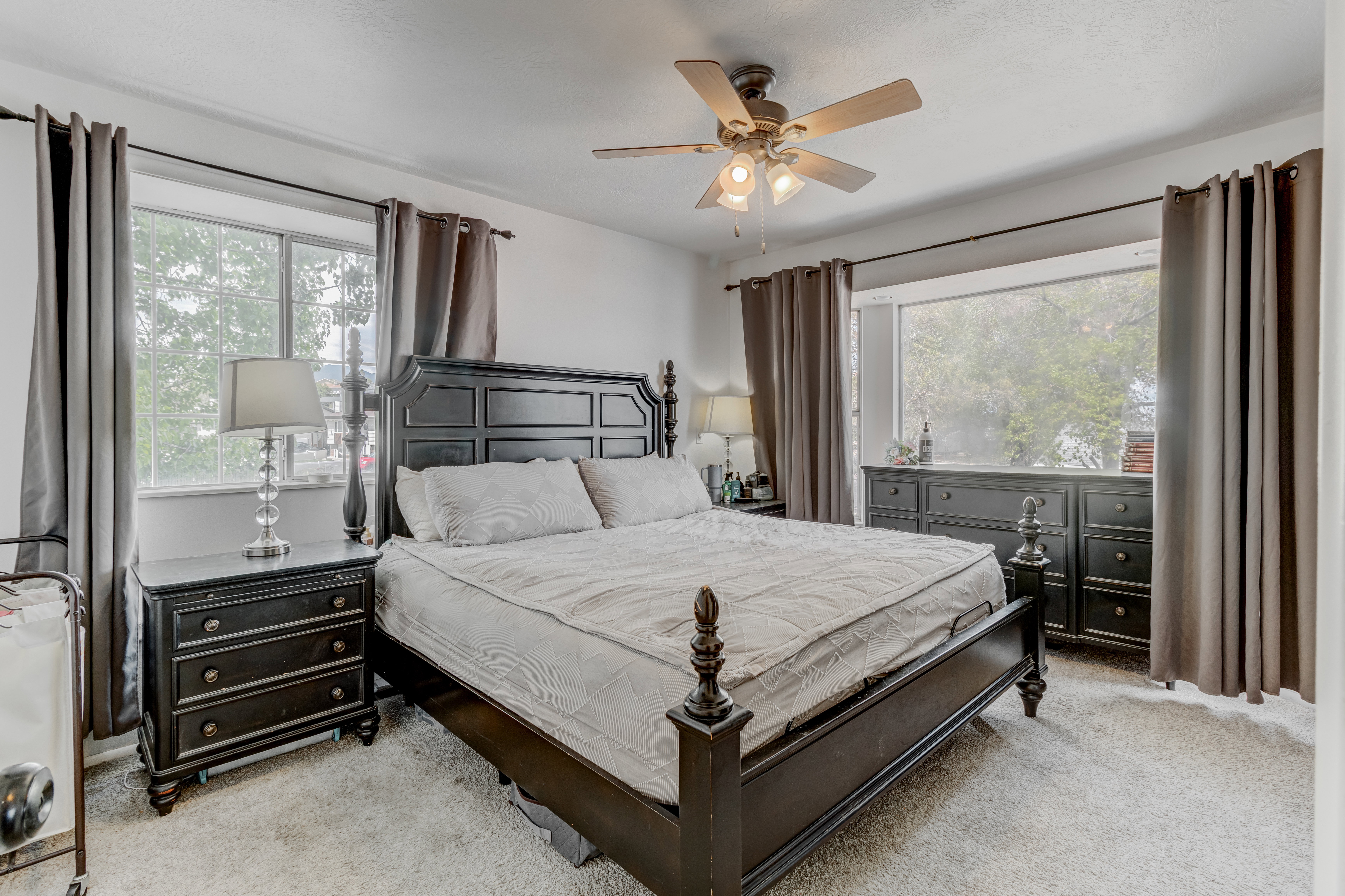 Bedroom with carpet flooring and ceiling fan