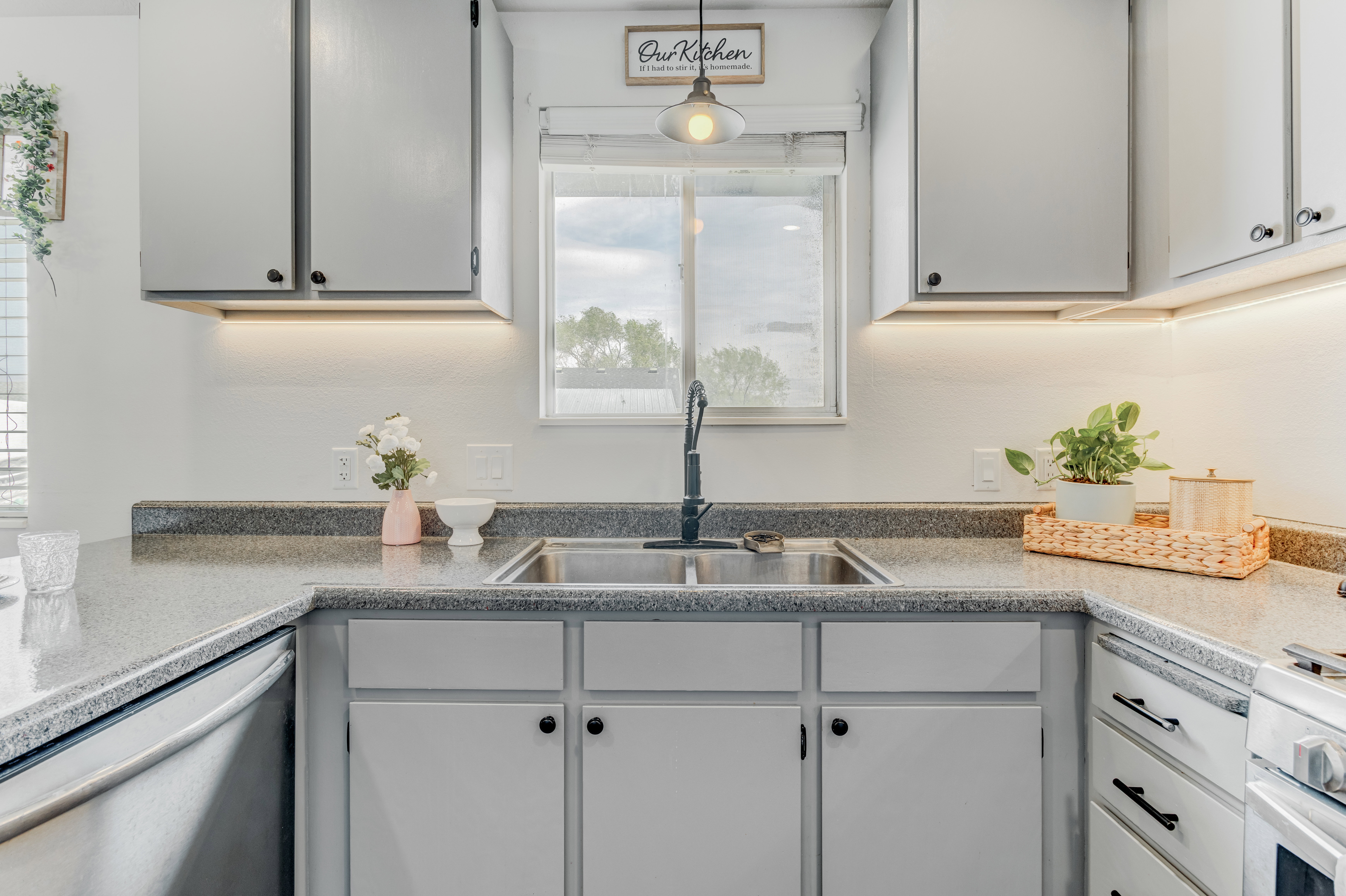 Kitchen with stainless steel dishwasher,