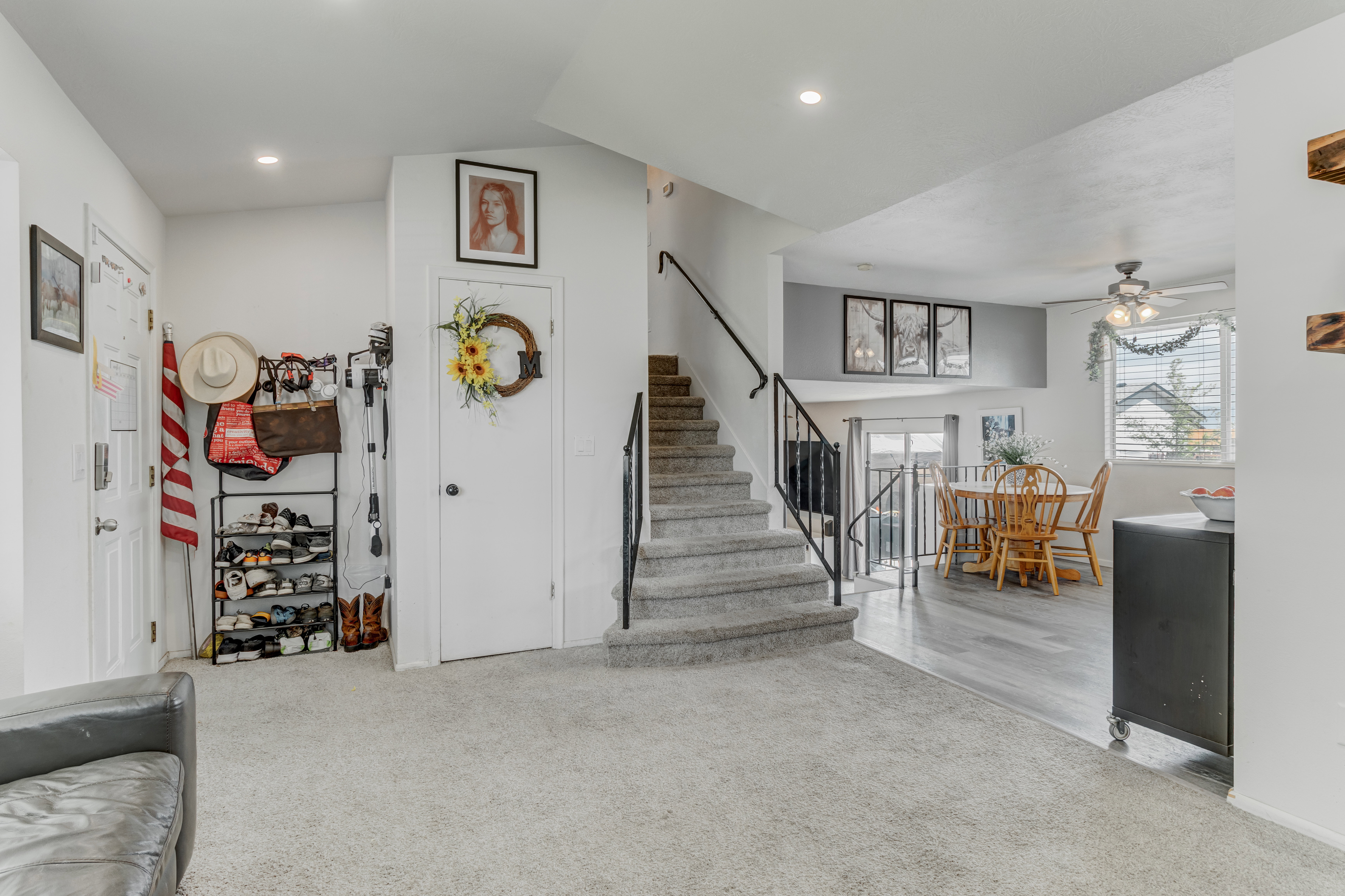 Staircase featuring ceiling fan, recessed lighting, and carpet flooring