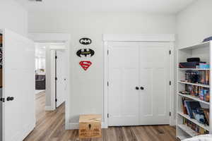 Bedroom featuring light wood-style flooring and a closet