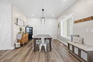 Dining space with recessed lighting and wood finished floors
