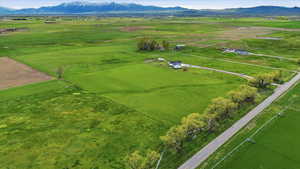 View of rural area featuring a mountain backdrop and a pastoral area