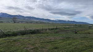 View of mountain backdrop featuring rural landscape