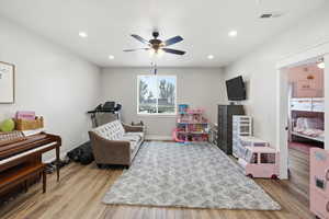 Playroom featuring ceiling fan, light wood-type flooring, and recessed lighting