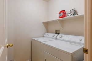 Laundry area featuring independent washer and dryer