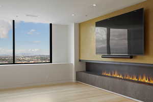 Spare room with light wood finished floors and recessed lighting