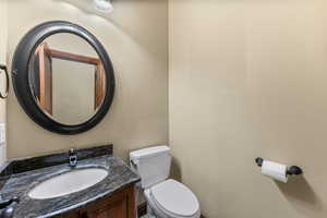 Half bath with vanity and toilet