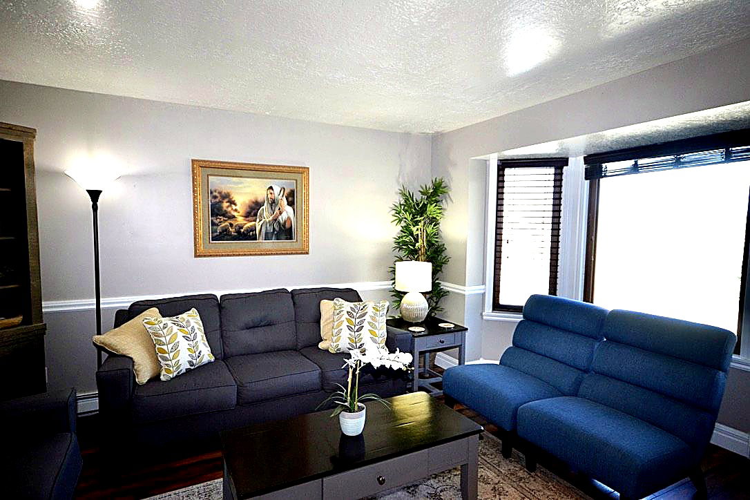 Living room featuring a textured ceiling and wood finished floors