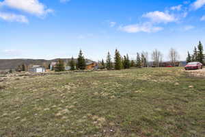 View of grassy yard featuring a view of countryside