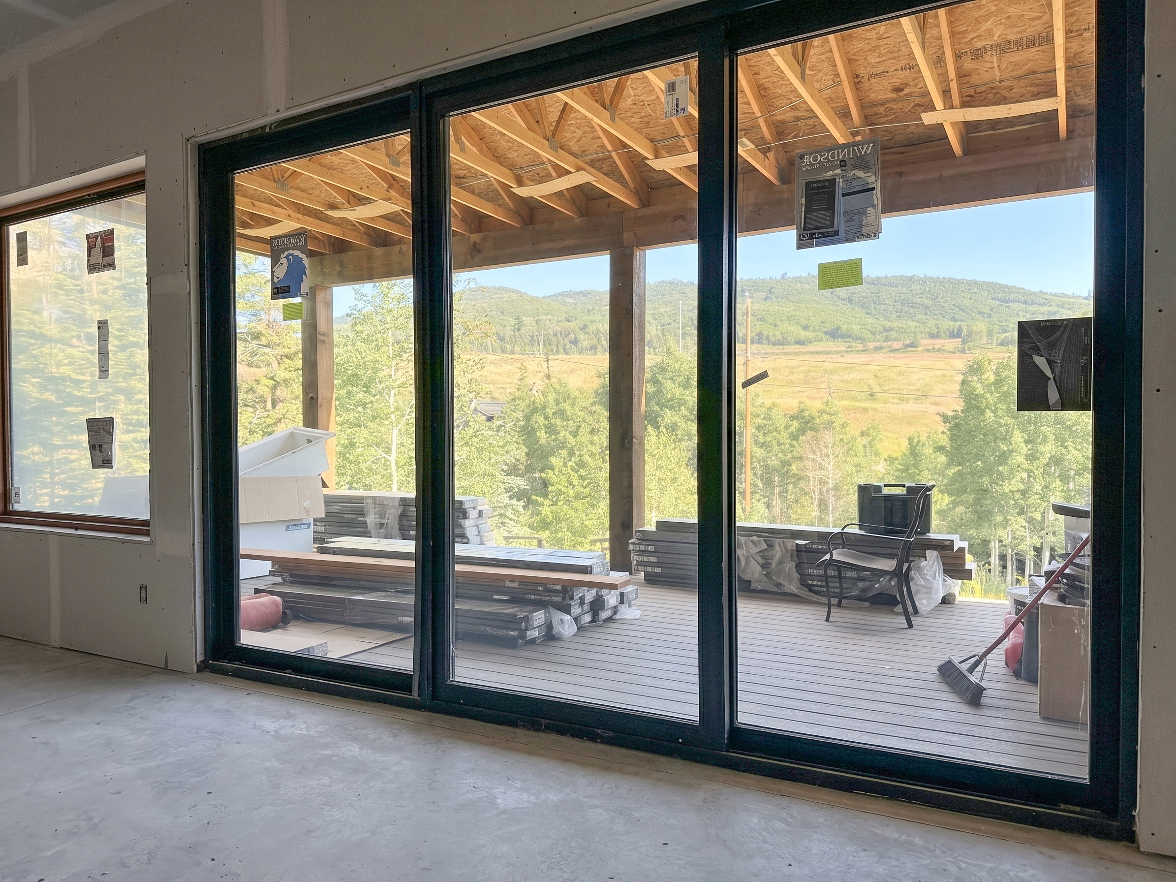 Expansive sliding glass doors opening to an outdoor deck