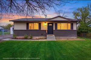 View of front of house with brick siding and entry steps