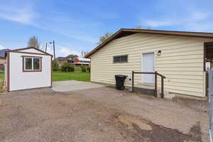 Rear view of house with a shed