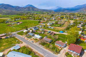 Aerial perspective of suburban area featuring a mountainous background