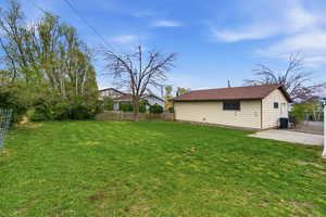Fenced yard featuring a patio