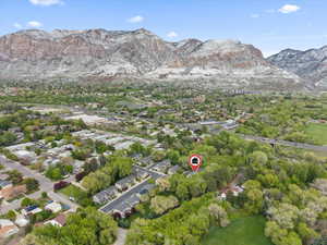 Aerial view of residential area featuring a mountain backdrop
