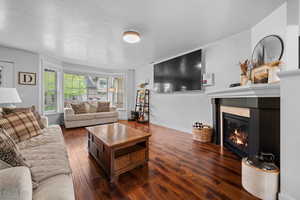 Expansive great room with fireplace and huge window