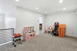 Playroom featuring recessed lighting and light colored carpet