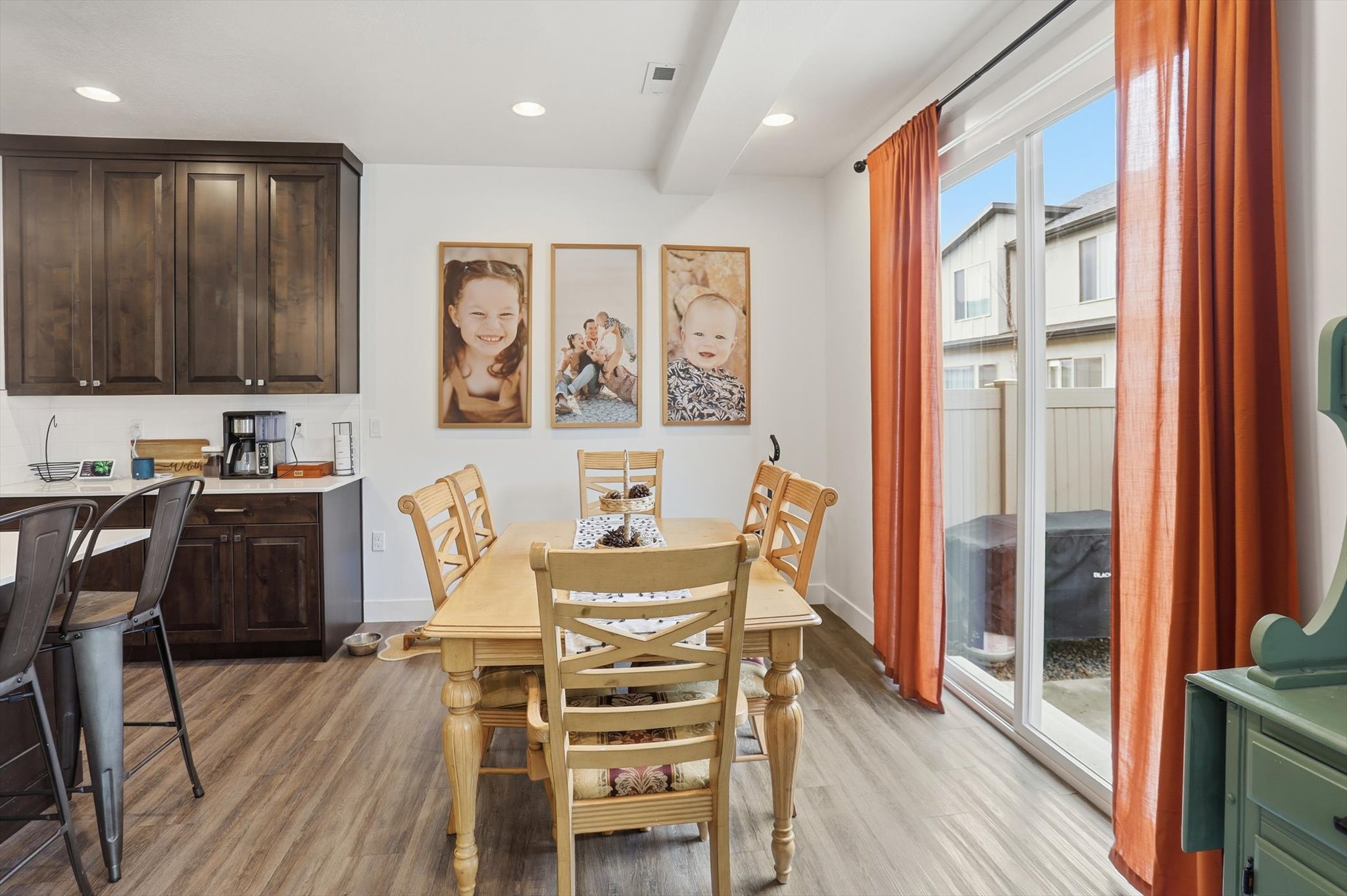 Dining space with light wood-type flooring and recessed lighting