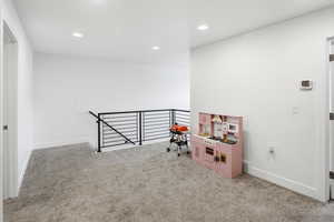 Game room featuring light colored carpet and recessed lighting