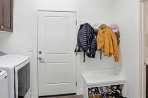 Laundry area with cabinet space and washing machine and clothes dryer