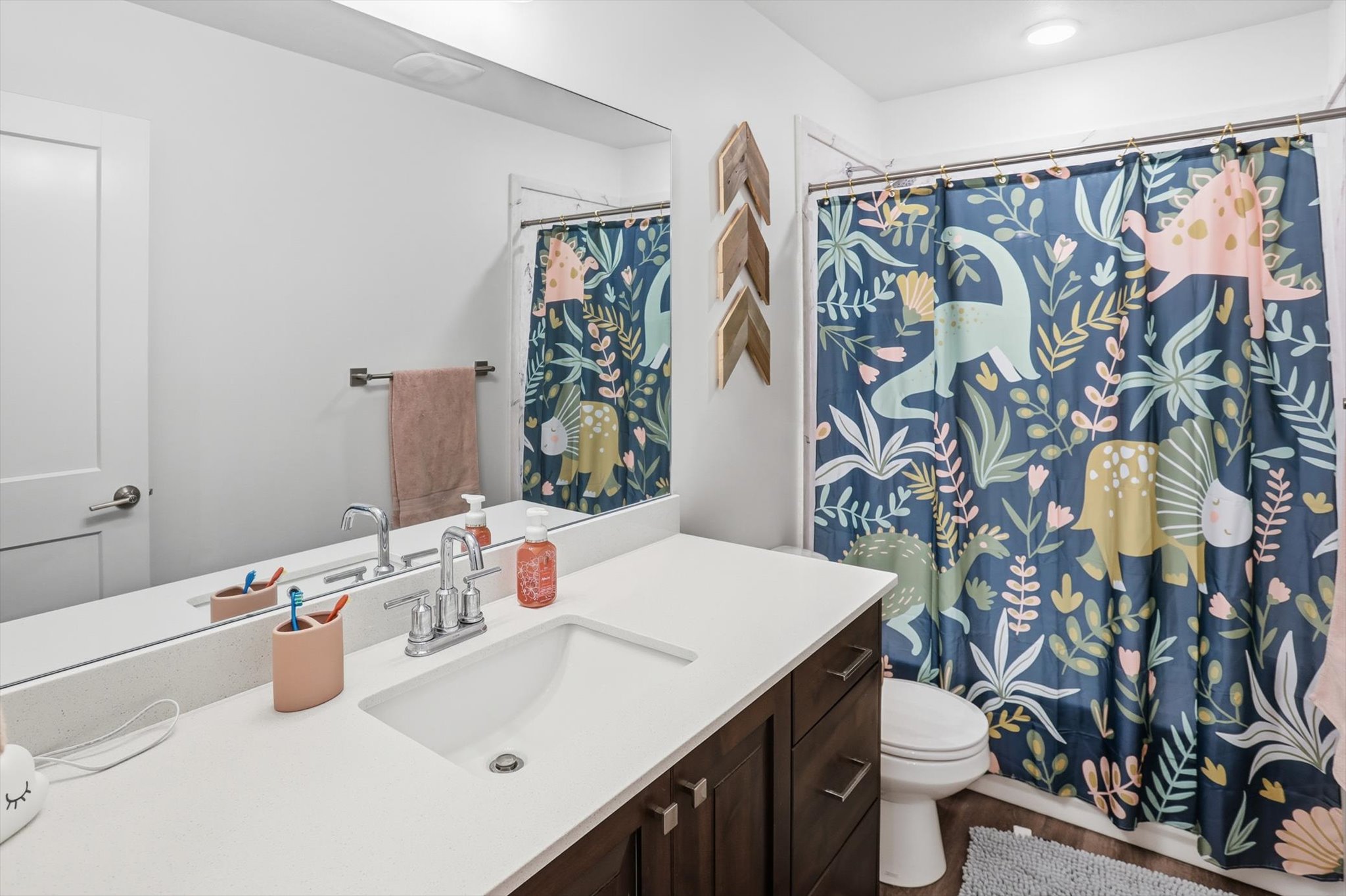 Bathroom featuring vanity and curtained shower