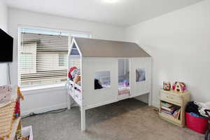 Bedroom with carpet and baseboards