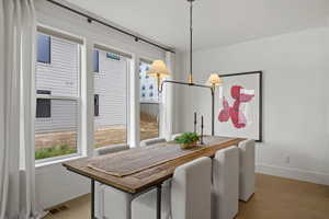 Dining space with light wood finished floors