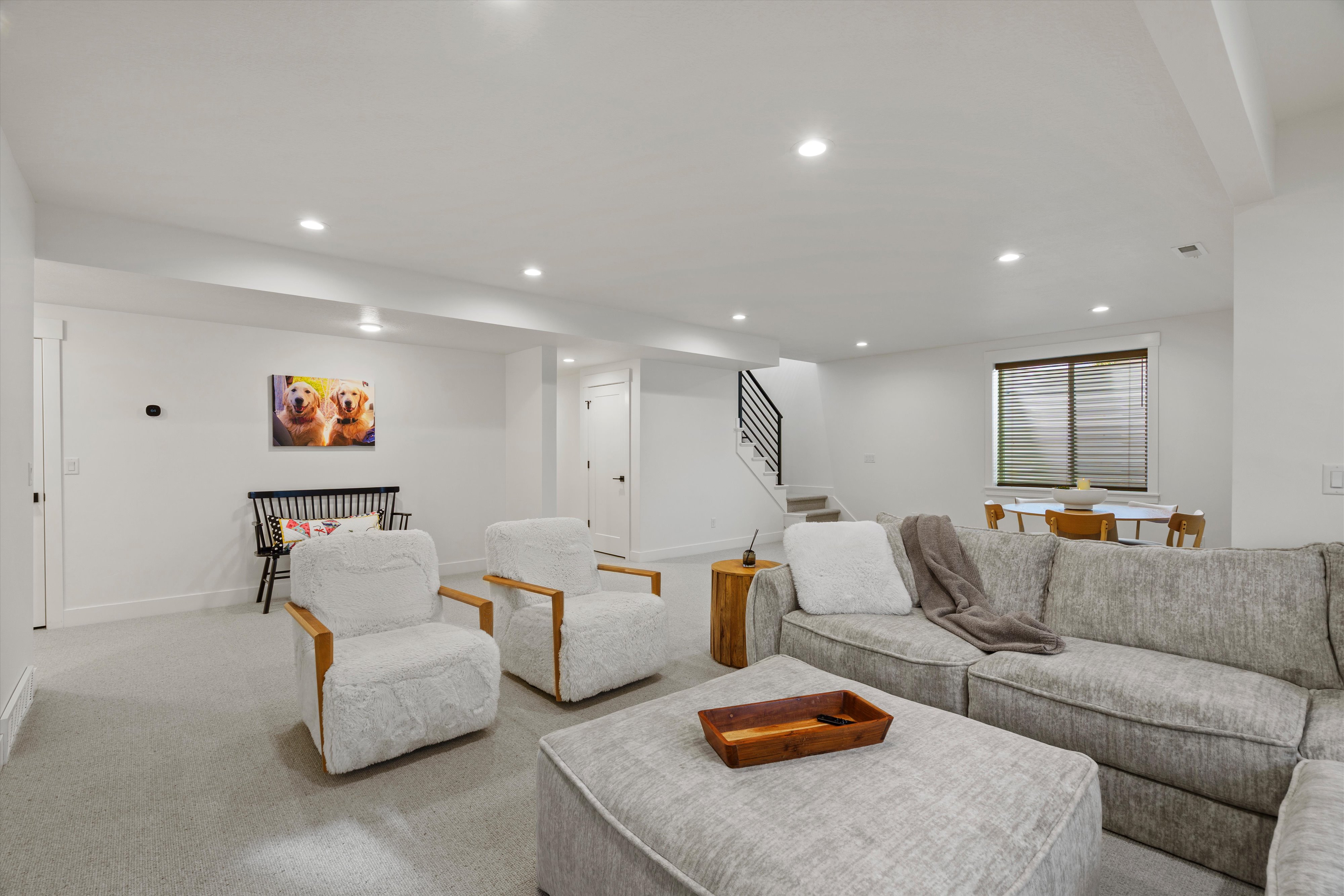 Living room with carpet flooring and recessed lighting