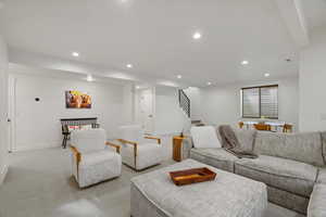 Living room with carpet flooring and recessed lighting