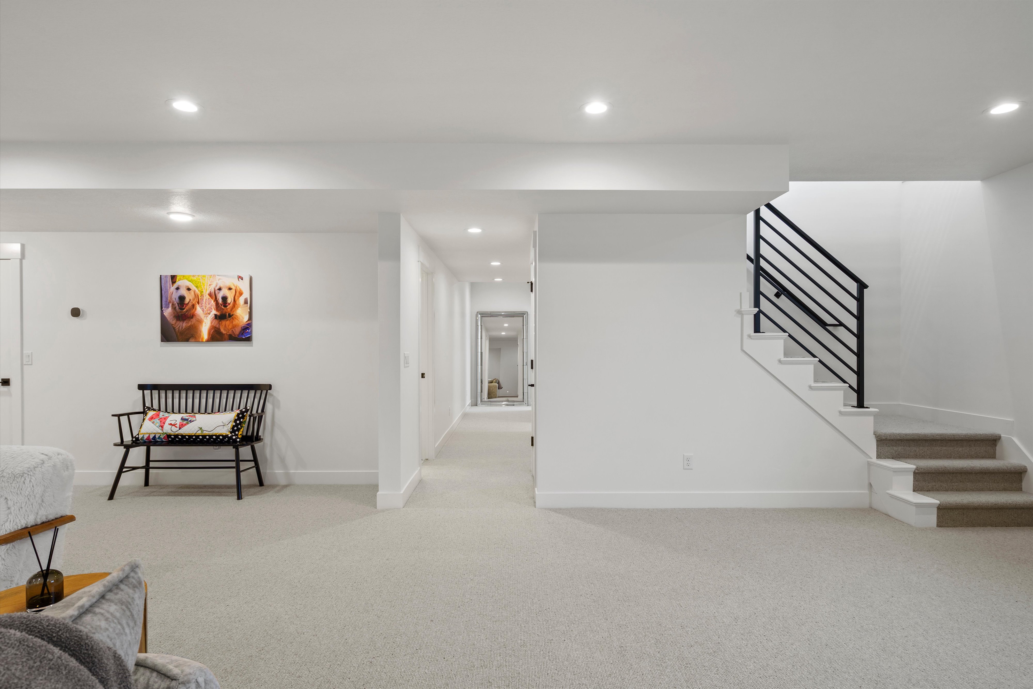 Finished below grade area with light carpet and recessed lighting