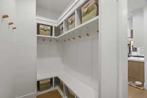 Mudroom featuring light wood-style floors