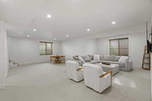 Living room featuring recessed lighting and light carpet