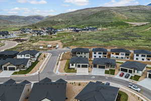 Aerial view of residential area featuring a mountain backdrop