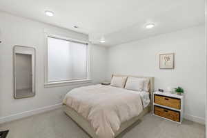 Bedroom with light carpet