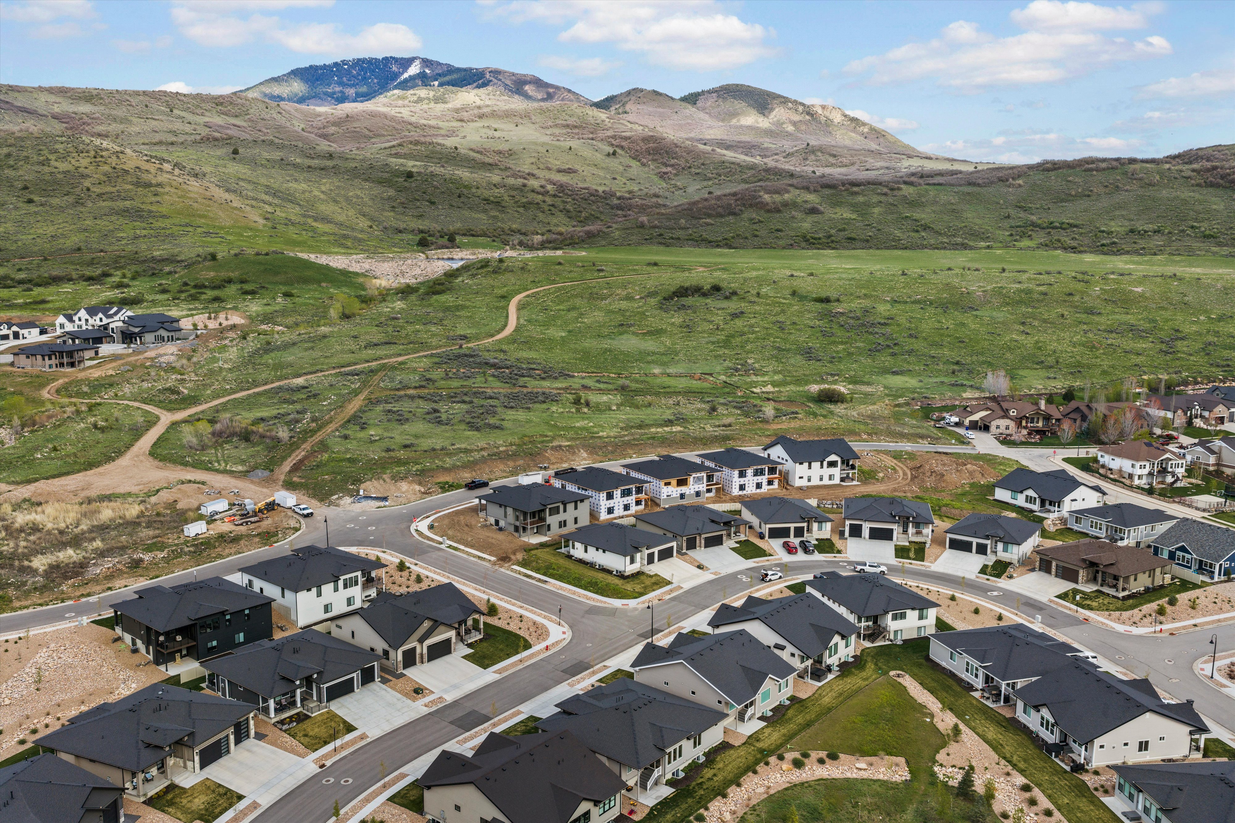 Aerial view of residential area featuring mountains