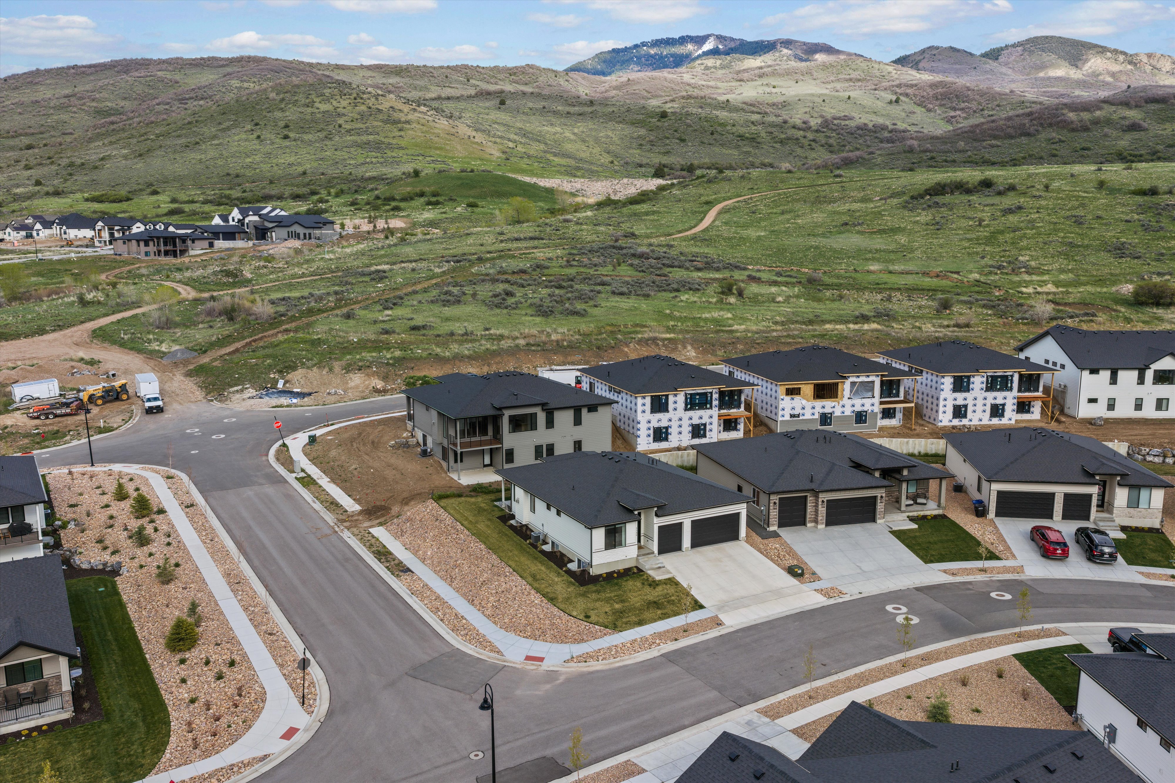 Aerial view of residential area featuring a mountainous background