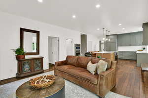Living room featuring dark wood finished floors and recessed lighting