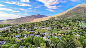 Aerial perspective of suburban area featuring a mountain backdrop