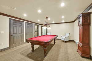 Rec room featuring light colored carpet, ornamental molding, billiards, and recessed lighting
