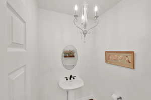 Half bath with a chandelier