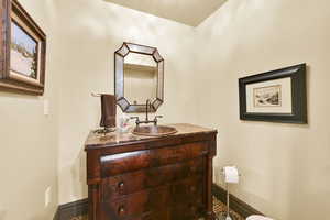 Half bath with vanity and toilet