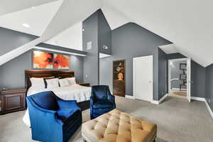 Bedroom featuring carpet floors and a high ceiling