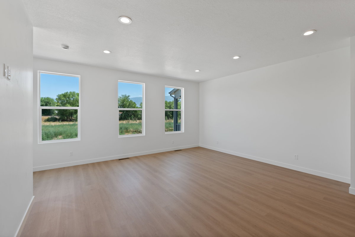 Spare room with light wood-style floors and recessed lighting