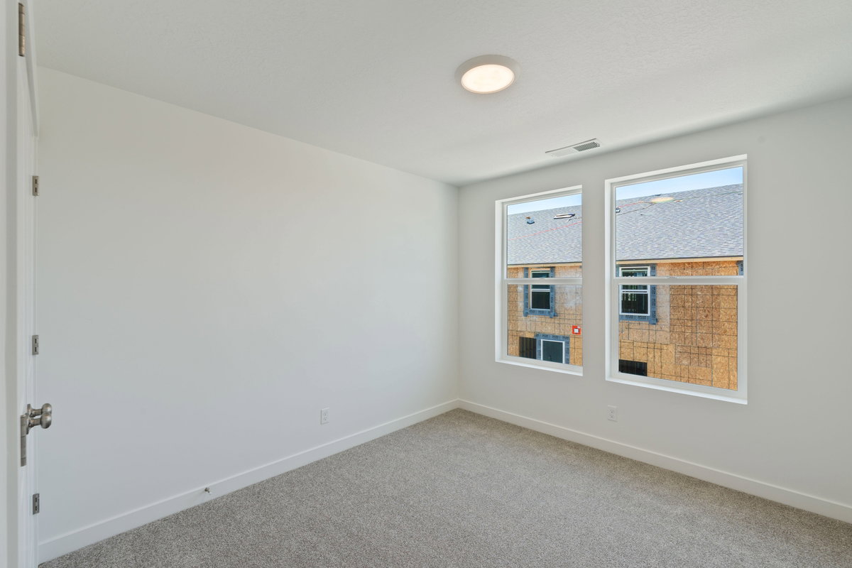 Unfurnished room featuring baseboards and carpet flooring