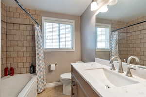 Bathroom with vanity and shower / bath combo