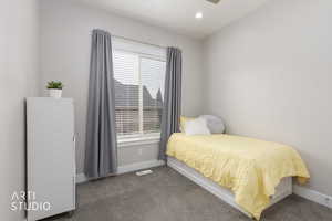 Bedroom featuring dark colored carpet, recessed lighting, and ceiling fan