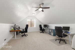 Office area with light colored carpet and ceiling fan