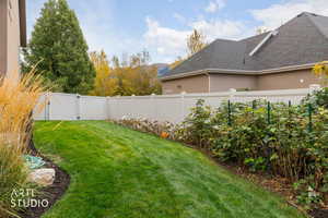 Fenced backyard featuring a gate and a mountain view